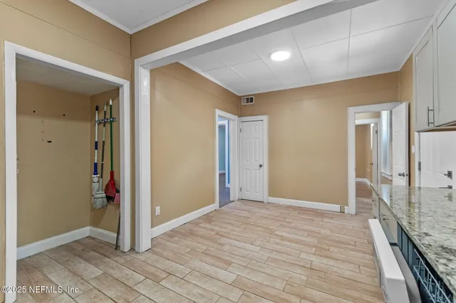 a view of hallway with wooden floor