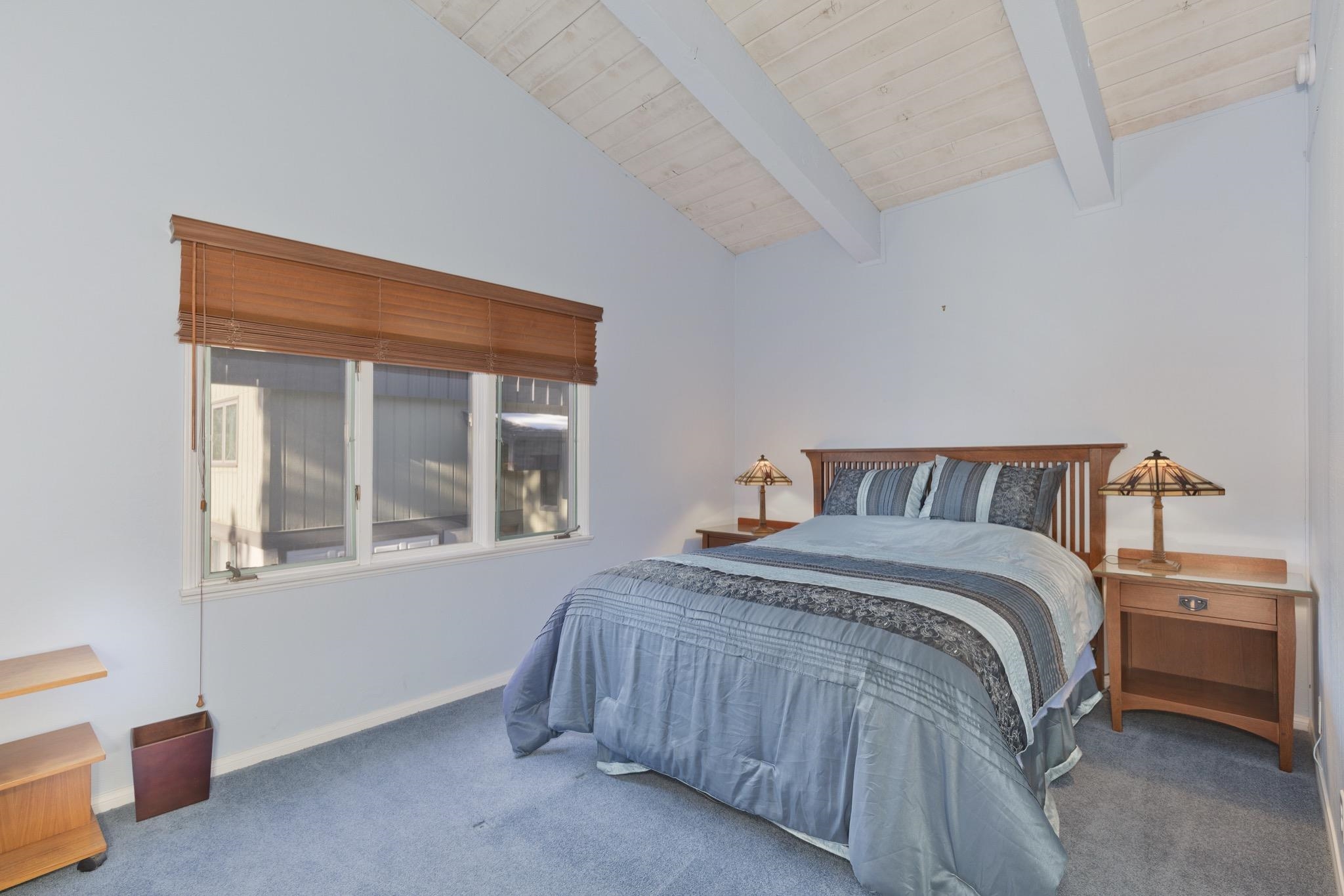 3251 Chateau Road, Unit 40 Mammoth Lakes, CA 93546 - Photo 18 of 31 Bedroom featuring vaulted ceiling with beams and carpet flooring