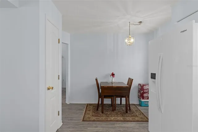a workspace room with furniture and wooden floor