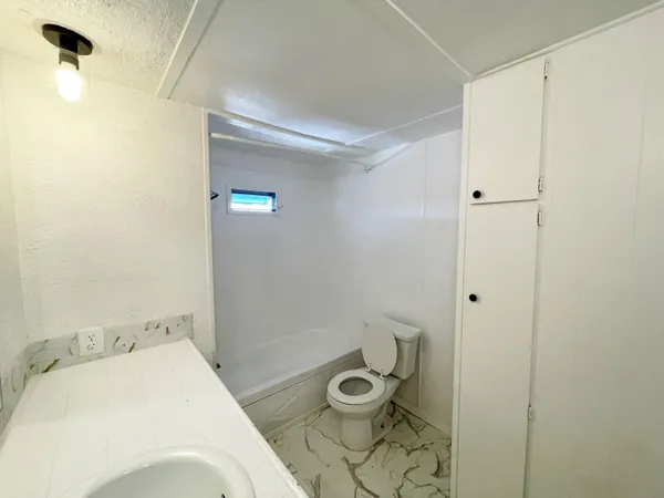 a bathroom with a sink and a toilet