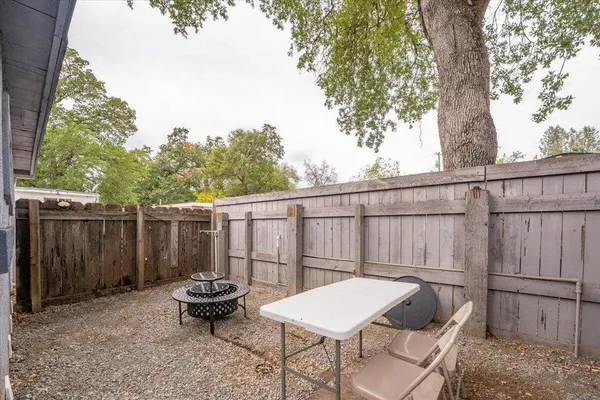 a backyard of a house with barbeque oven