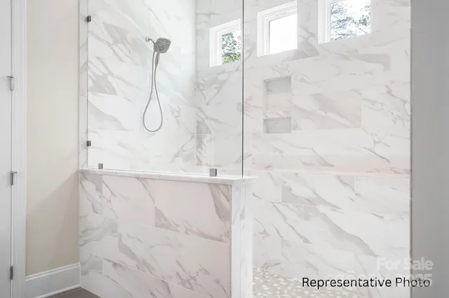 a bathroom with a granite countertop double vanity sinks and a mirror