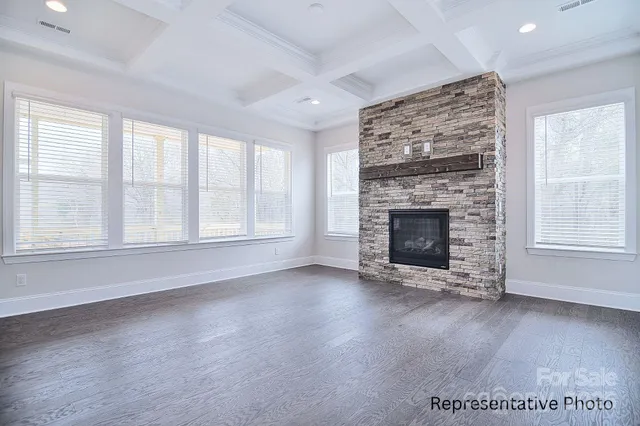 a hall with a sink a fireplace and a table