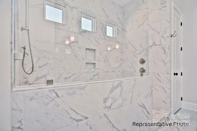 a bathroom with a bathtub and shower