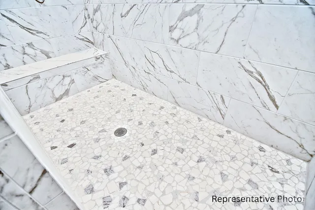 a bathroom with a double vanity sink and mirror