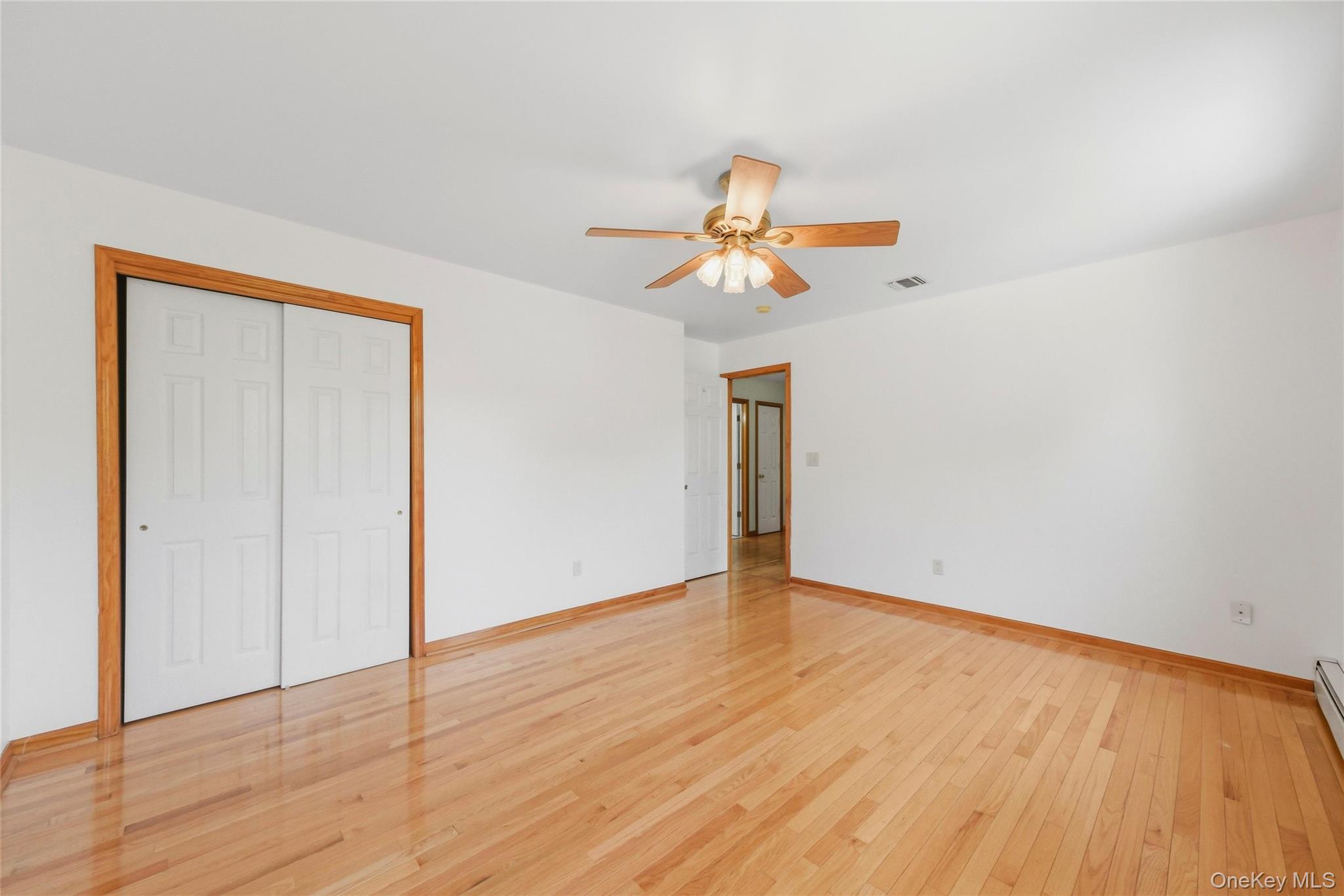 5 Horton Road Washingtonville, NY 10992 - Photo 27 of 42 a view of an empty room with wooden floor and a window