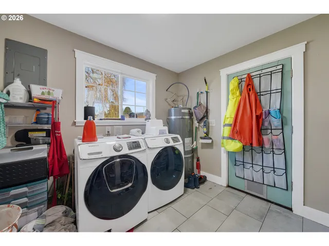 a kitchen with stainless steel appliances a stove and a microwave