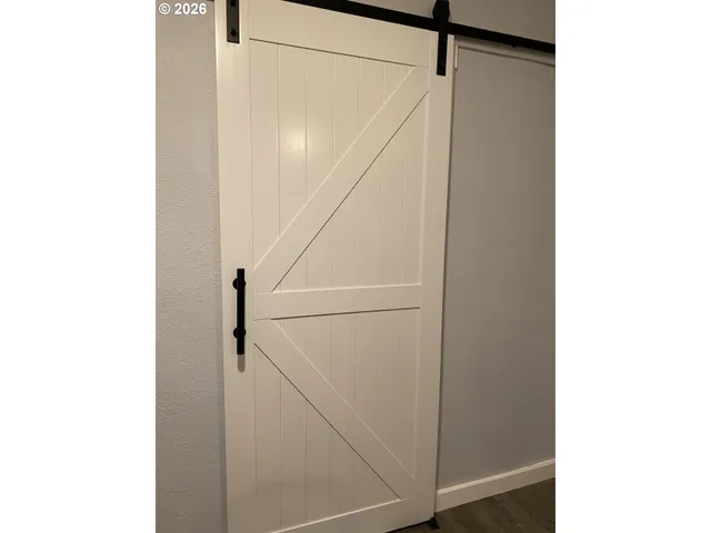 a view of staircase with white walls