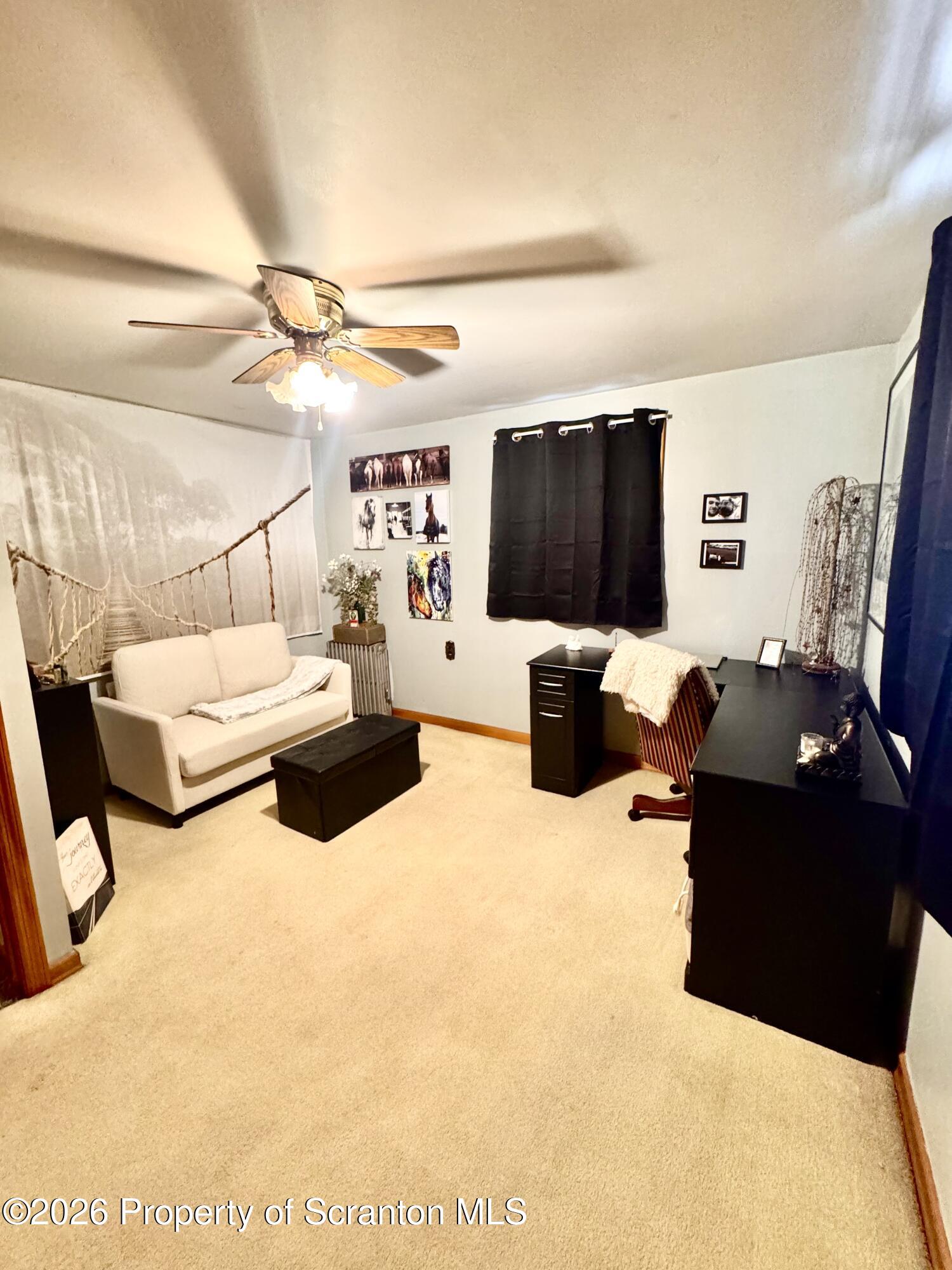 420 Delaware Street Jermyn, PA 18433 - Photo 12 of 22 a living room with furniture and a flat screen tv