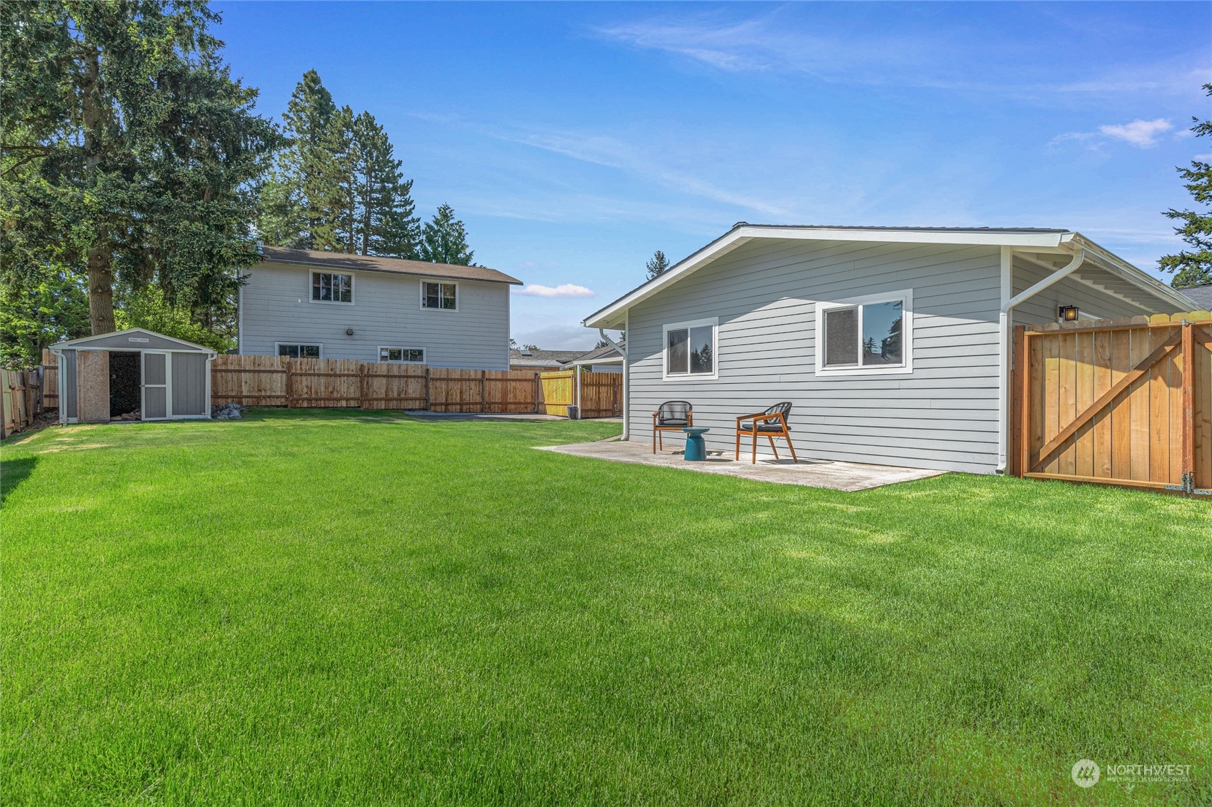 4333 Southeast 3rd Street Renton, WA 98059 - Photo 29 of 32 a backyard of a house with table and chairs
