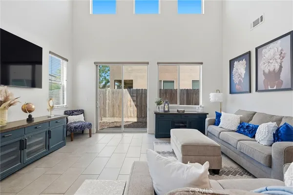 a kitchen with a sink dishwasher a refrigerator and a stove with wooden cabinets