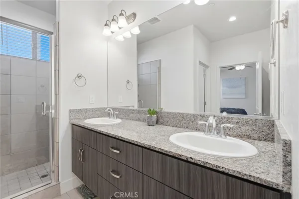 a bathroom with a sink and mirror
