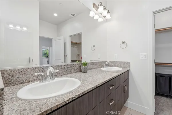 a spacious bedroom with a bed and window