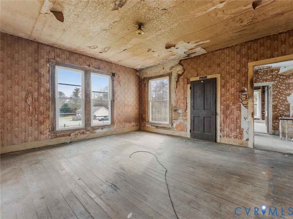 8571 Guinea Road Hayes, VA 23072 - Photo 18 of 45 an empty room with windows