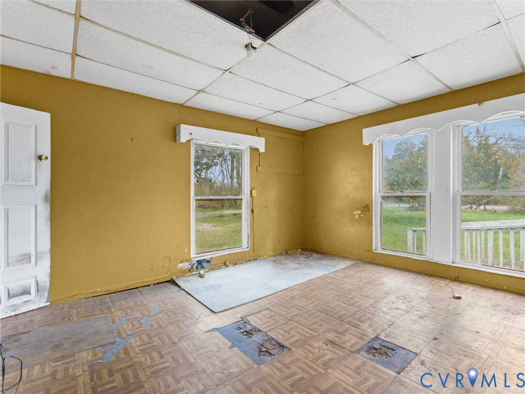 8571 Guinea Road Hayes, VA 23072 - Photo 24 of 45 a view of an empty room with a fireplace