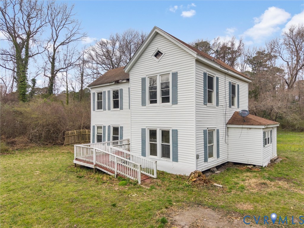 8571 Guinea Road Hayes, VA 23072 - Photo 5 of 45 a front view of a house with a yard
