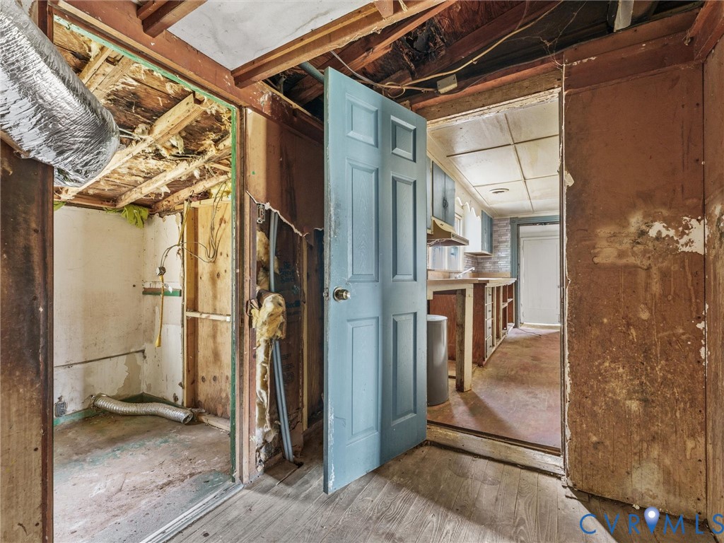 8571 Guinea Road Hayes, VA 23072 - Photo 7 of 45 a view of a house with a door and wooden floor