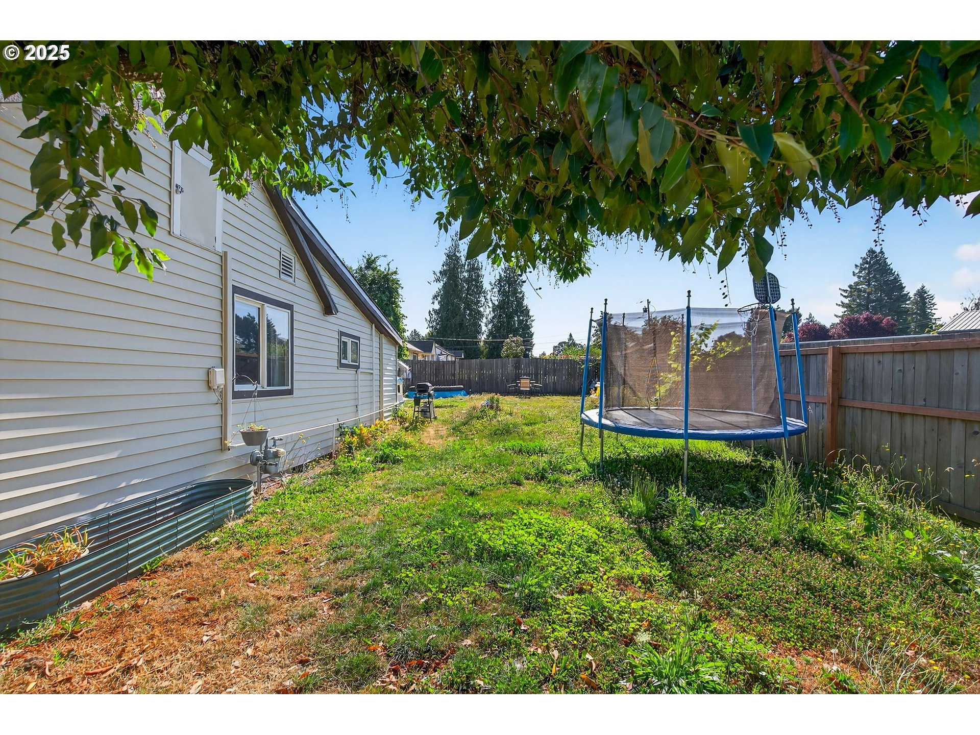 500 North Main Street Newberg, OR 97132 - Photo 20 of 23 a backyard of a house with lots of green space