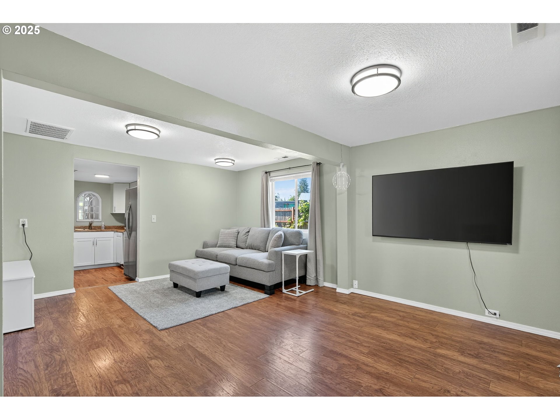 500 North Main Street Newberg, OR 97132 - Photo 4 of 23 a living room with furniture and a flat screen tv