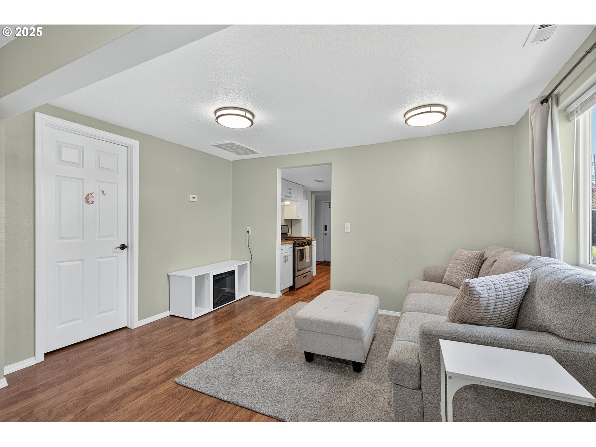 500 North Main Street Newberg, OR 97132 - Photo 8 of 23 a living room with furniture and a fireplace
