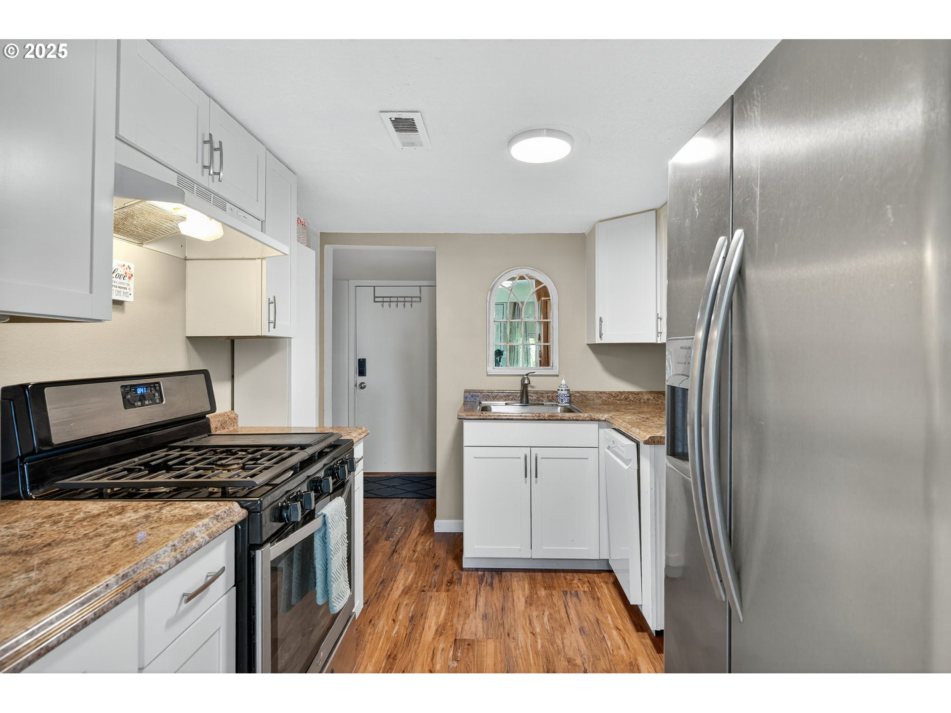 500 North Main Street Newberg, OR 97132 - Photo 10 of 23 a kitchen with stainless steel appliances granite countertop a stove a sink and a refrigerator