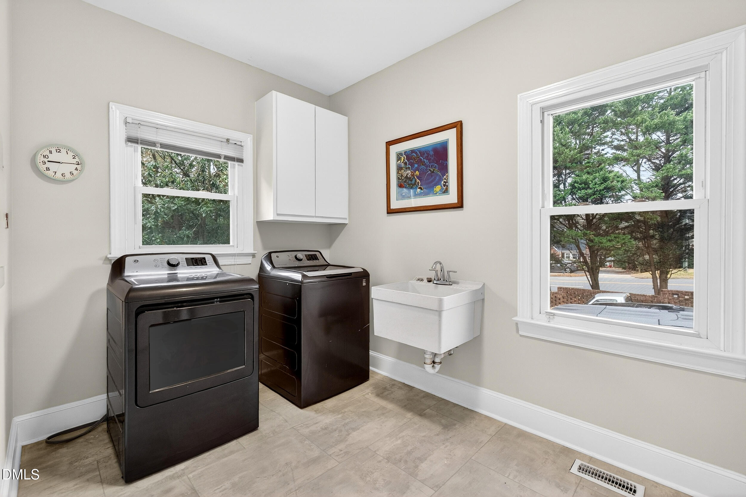 3735 Stoneybrook Drive Durham, NC 27705 - Photo 15 of 41 a view of a kitchen with washer and dryer