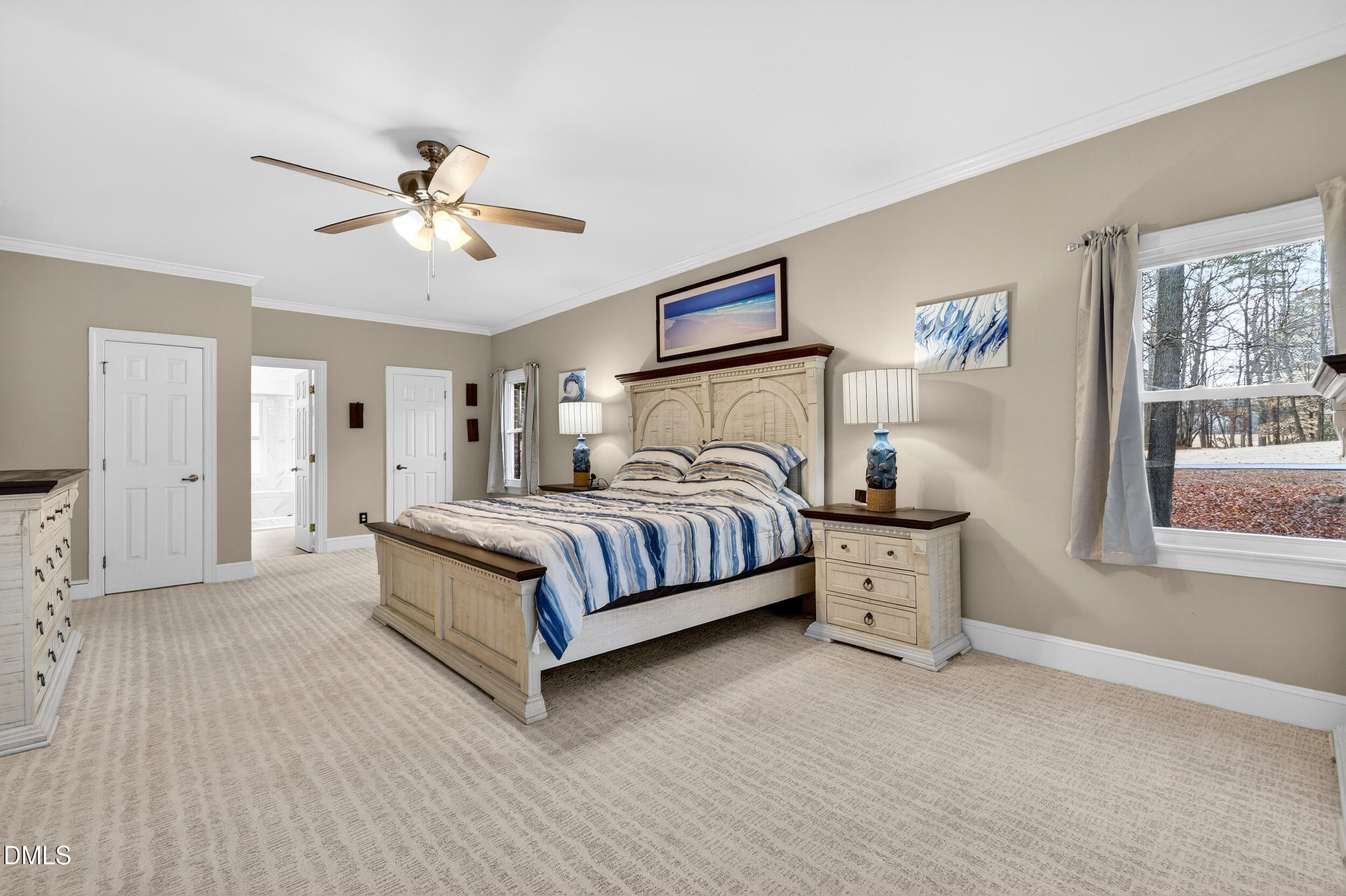 3735 Stoneybrook Drive Durham, NC 27705 - Photo 17 of 41 a bedroom with a large bed and a chandelier