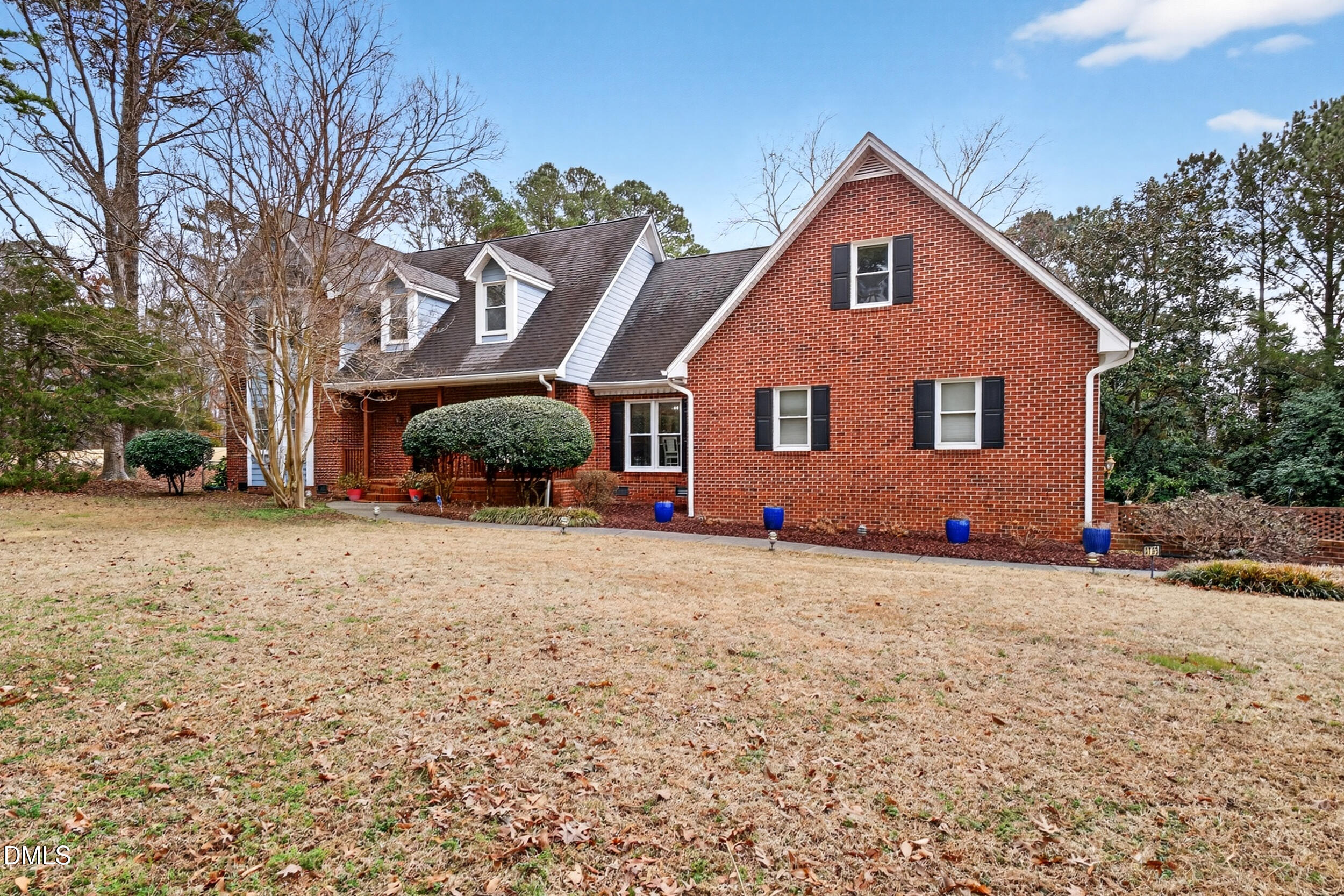 3735 Stoneybrook Drive Durham, NC 27705 - Photo 2 of 41 a front view of a house with a yard and garage