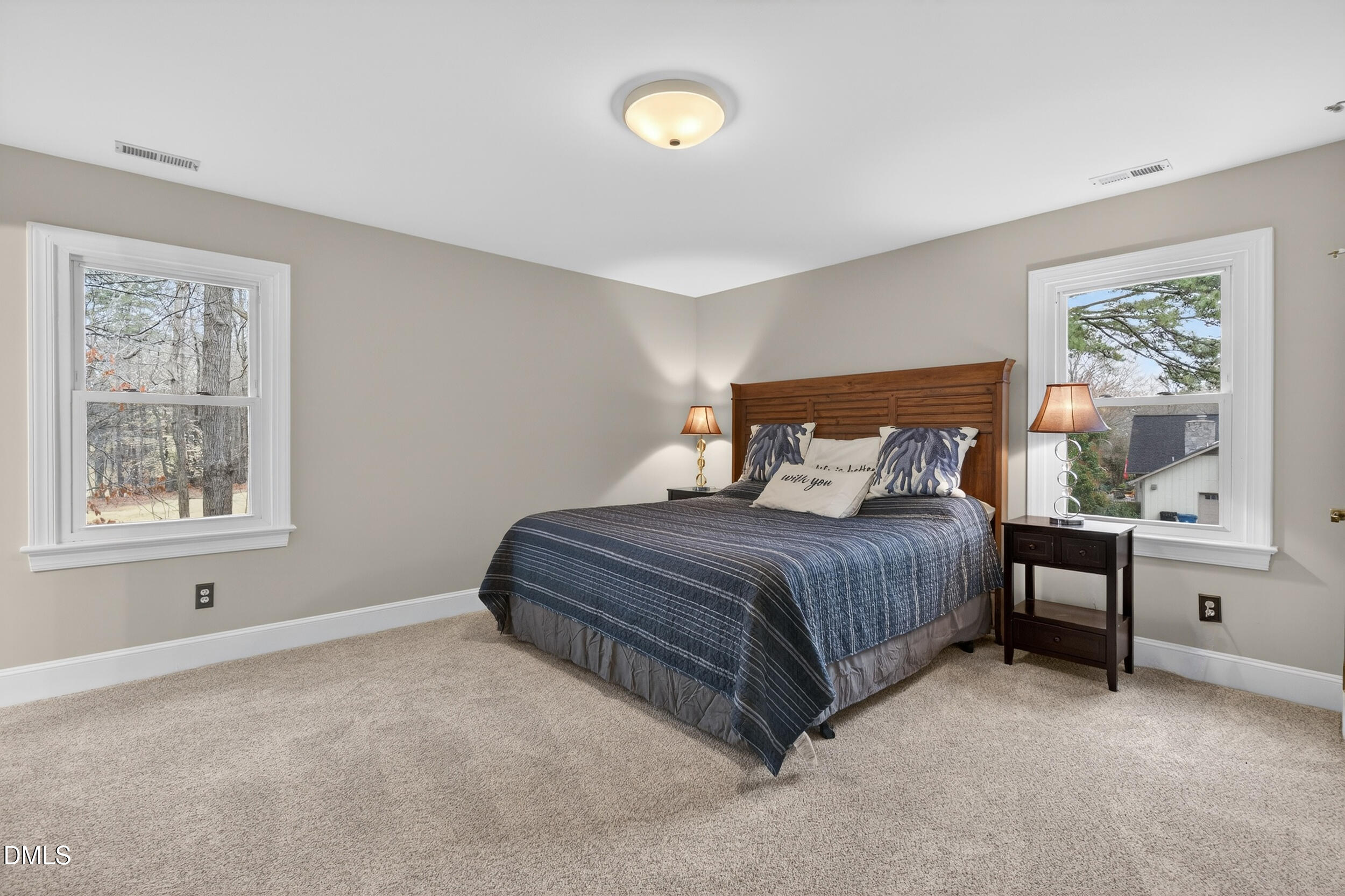 3735 Stoneybrook Drive Durham, NC 27705 - Photo 22 of 41 a bedroom with a bed and window