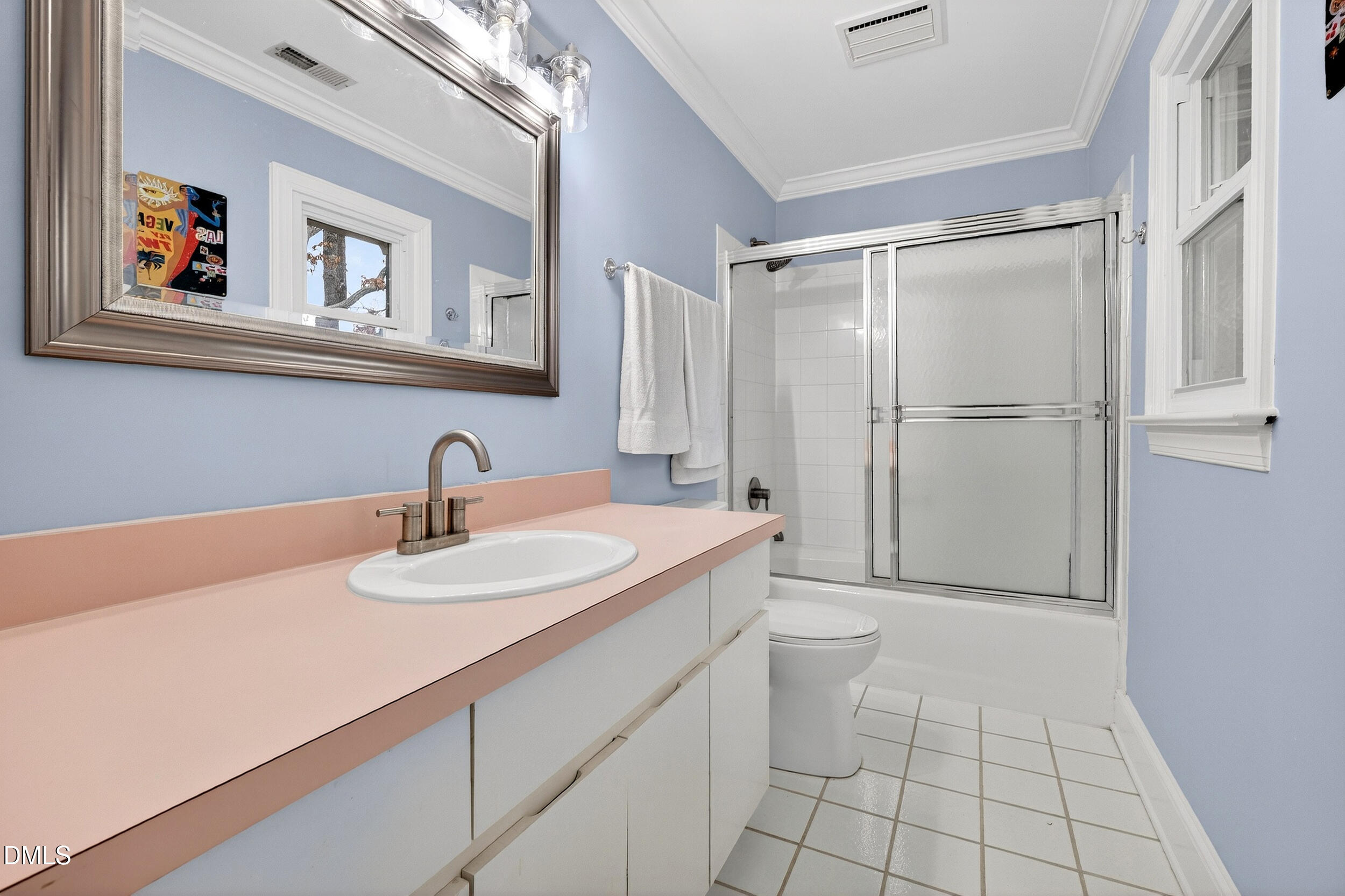 3735 Stoneybrook Drive Durham, NC 27705 - Photo 24 of 41 a bathroom with a granite countertop sink a toilet a shower and a mirror