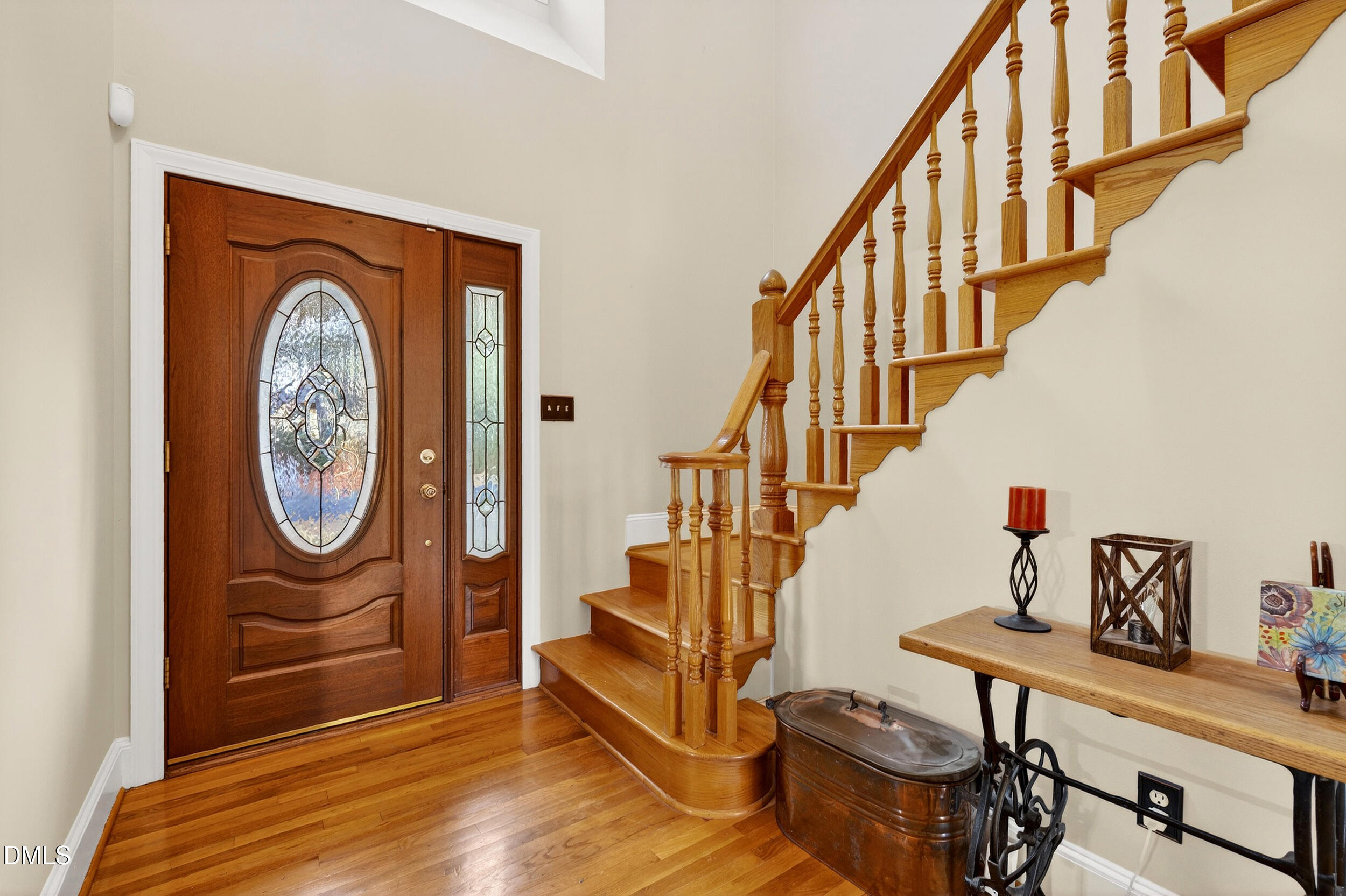 3735 Stoneybrook Drive Durham, NC 27705 - Photo 3 of 41 a view of an entryway with wooden floor and a potted plant