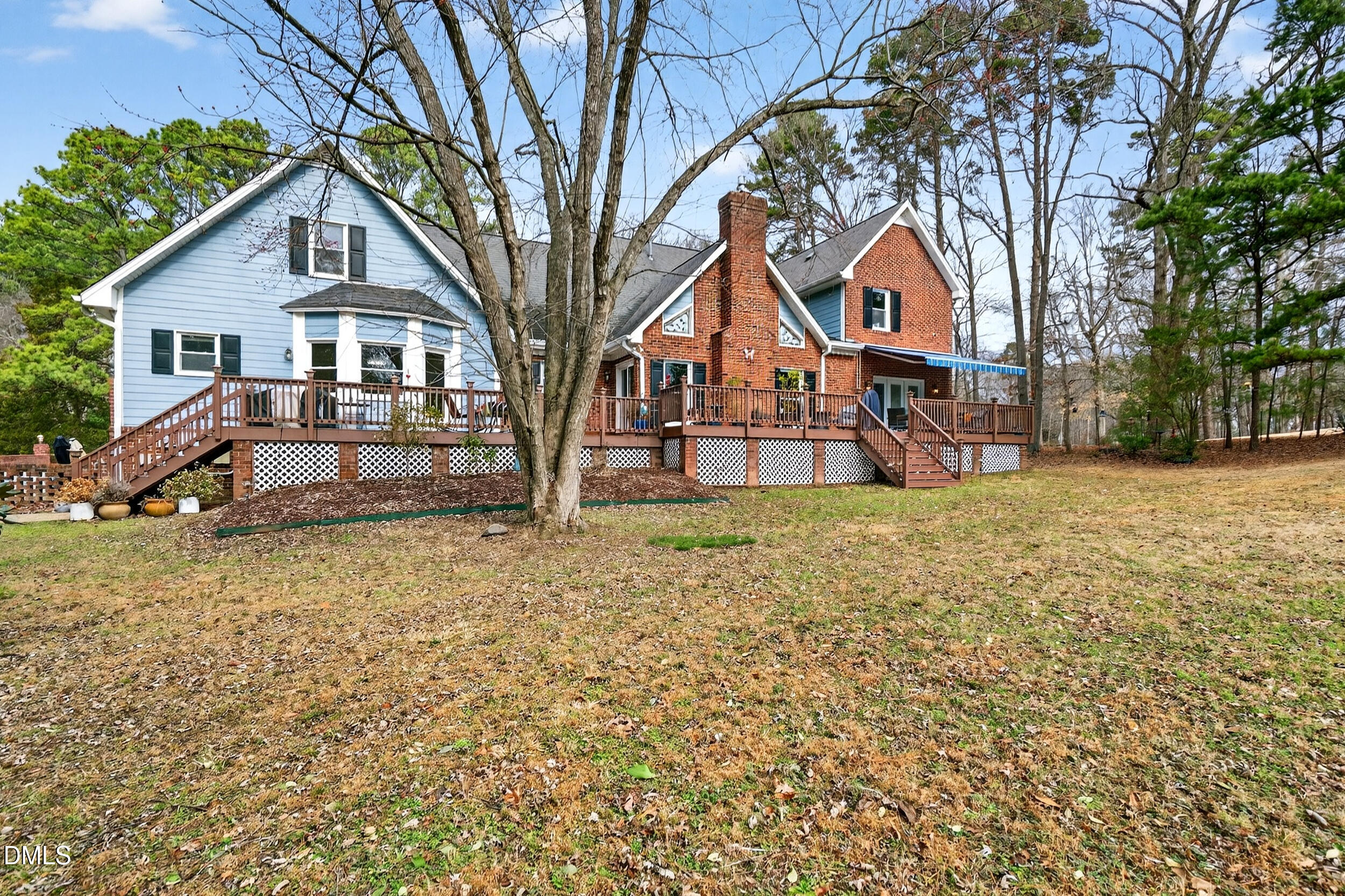3735 Stoneybrook Drive Durham, NC 27705 - Photo 31 of 41 a front view of a house with a yard and large trees