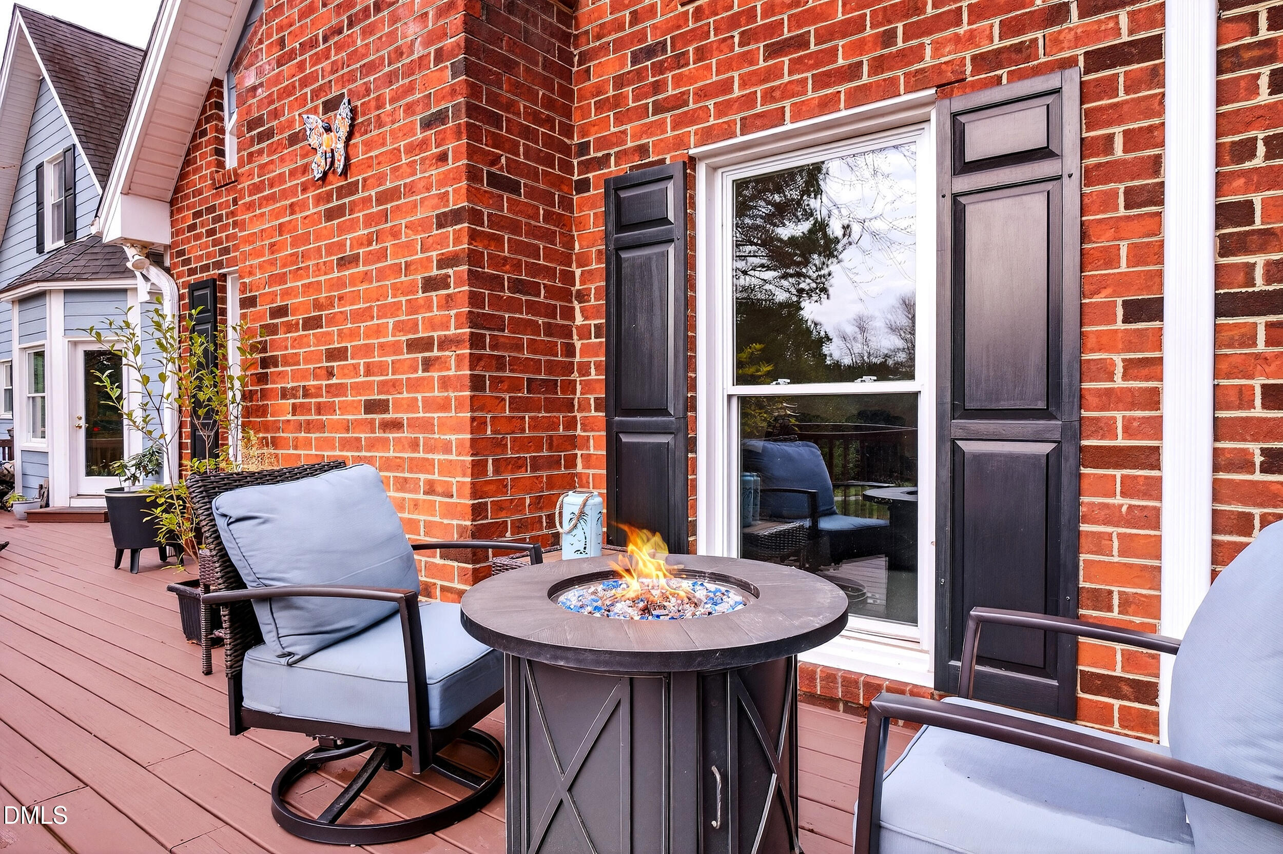 3735 Stoneybrook Drive Durham, NC 27705 - Photo 34 of 41 a backyard of a house with table and chairs