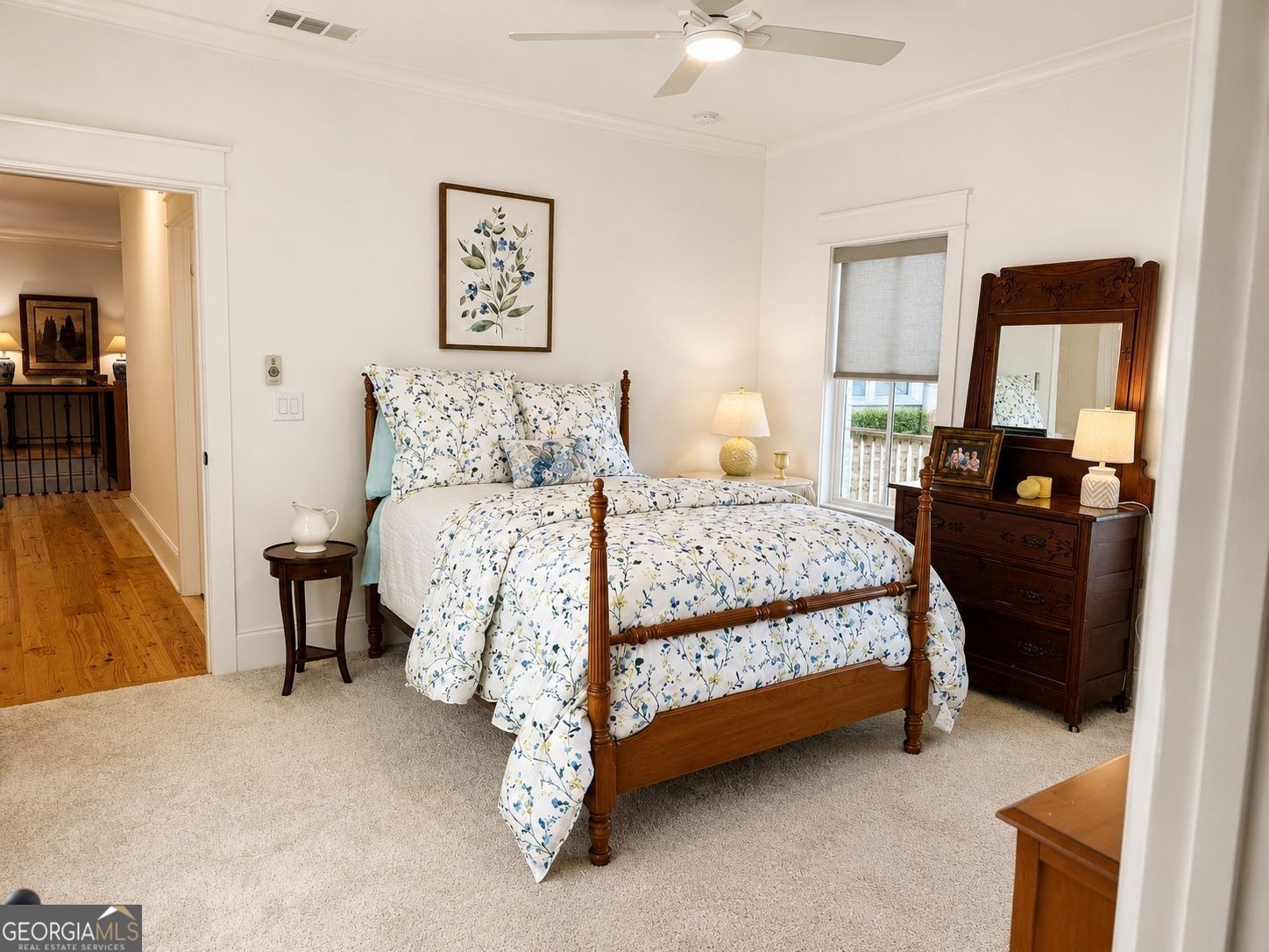 913 Indigo Bunting Road Statham, GA 30666 - Photo 26 of 31 a bedroom with a bed and a chandelier