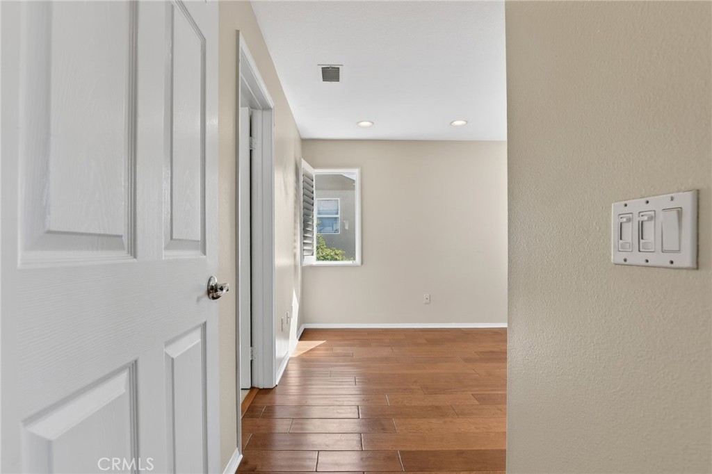 20543 Pesaro Porter Ranch Porter Ranch, CA 91326 - Photo 44 of 67 a view of a hallway with wooden floor