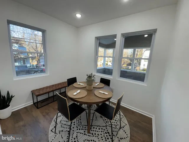 a view of a dining room with furniture and window