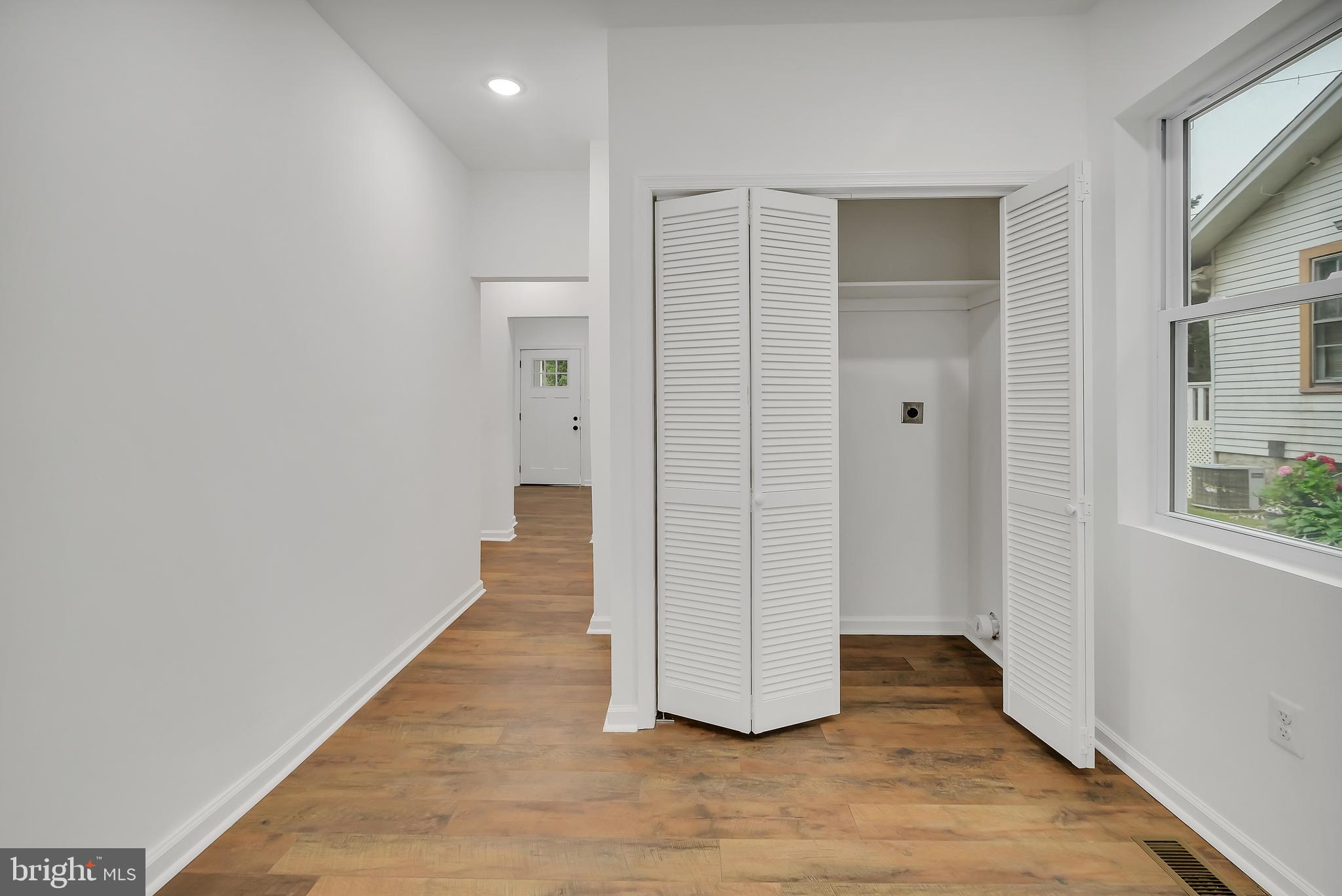 4116 32nd Street Mount Rainier, MD 20712 - Photo 20 of 51 an empty room with wooden floor and windows