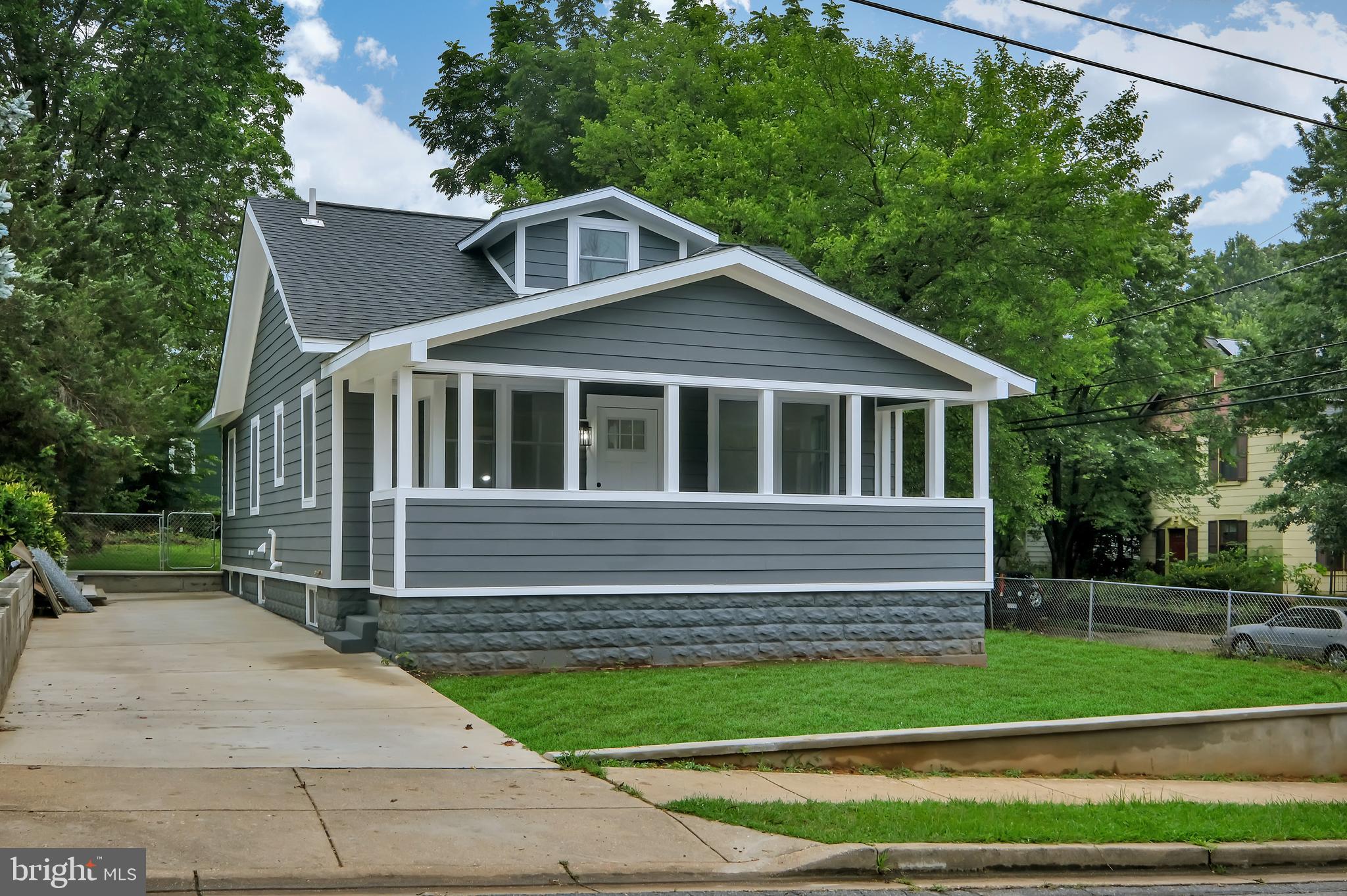 4116 32nd Street Mount Rainier, MD 20712 - Photo 2 of 51 a front view of a house with a yard
