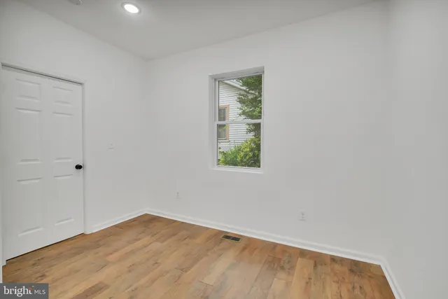 a view of room with window and hallway