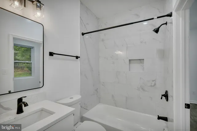 a bathroom with a sink a mirror and a shower