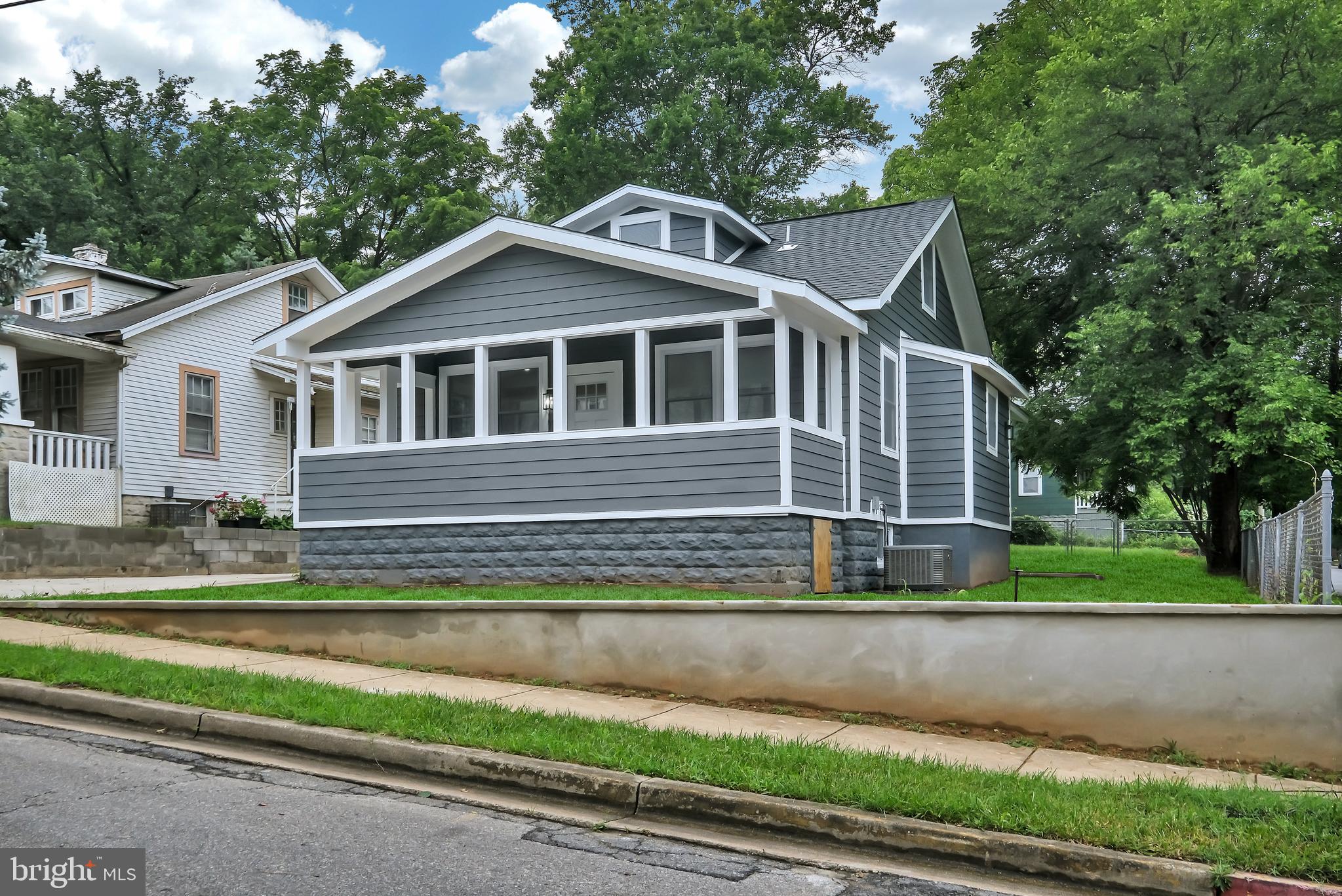 4116 32nd Street Mount Rainier, MD 20712 - Photo 3 of 51 a front view of a house with a yard