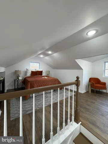 a bedroom with bed and a window