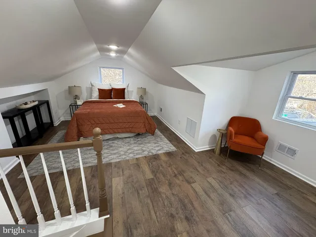 a bedroom with furniture and window