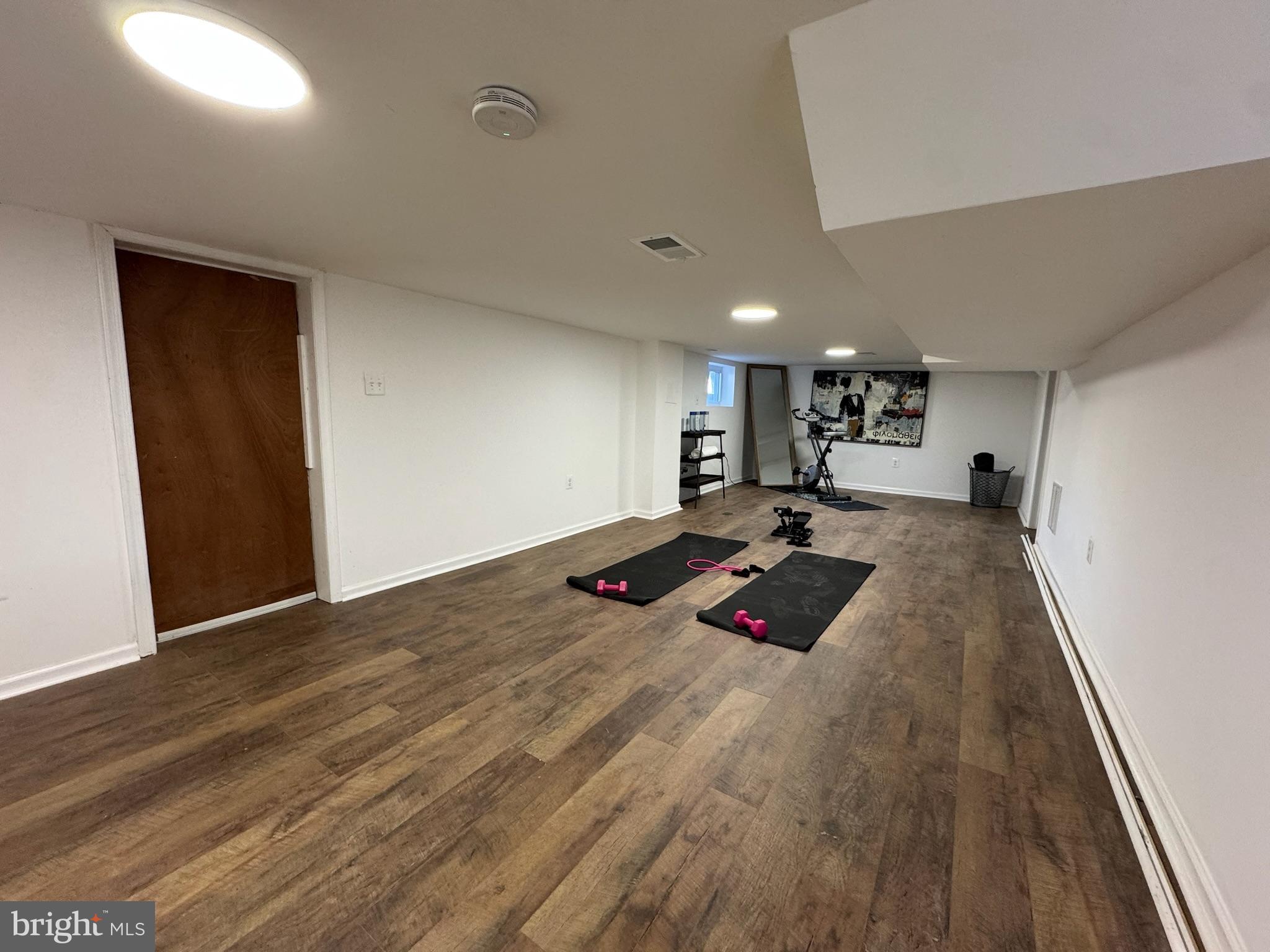 4116 32nd Street Mount Rainier, MD 20712 - Photo 38 of 51 a room with wooden floor and furniture