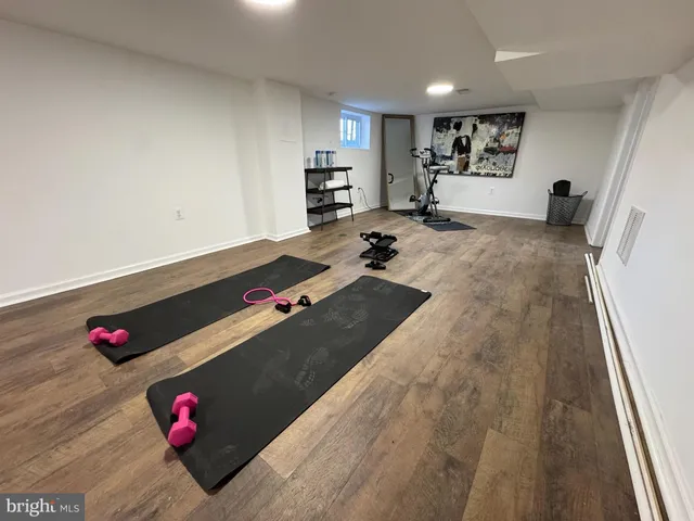 a living room with kitchen view and a couch