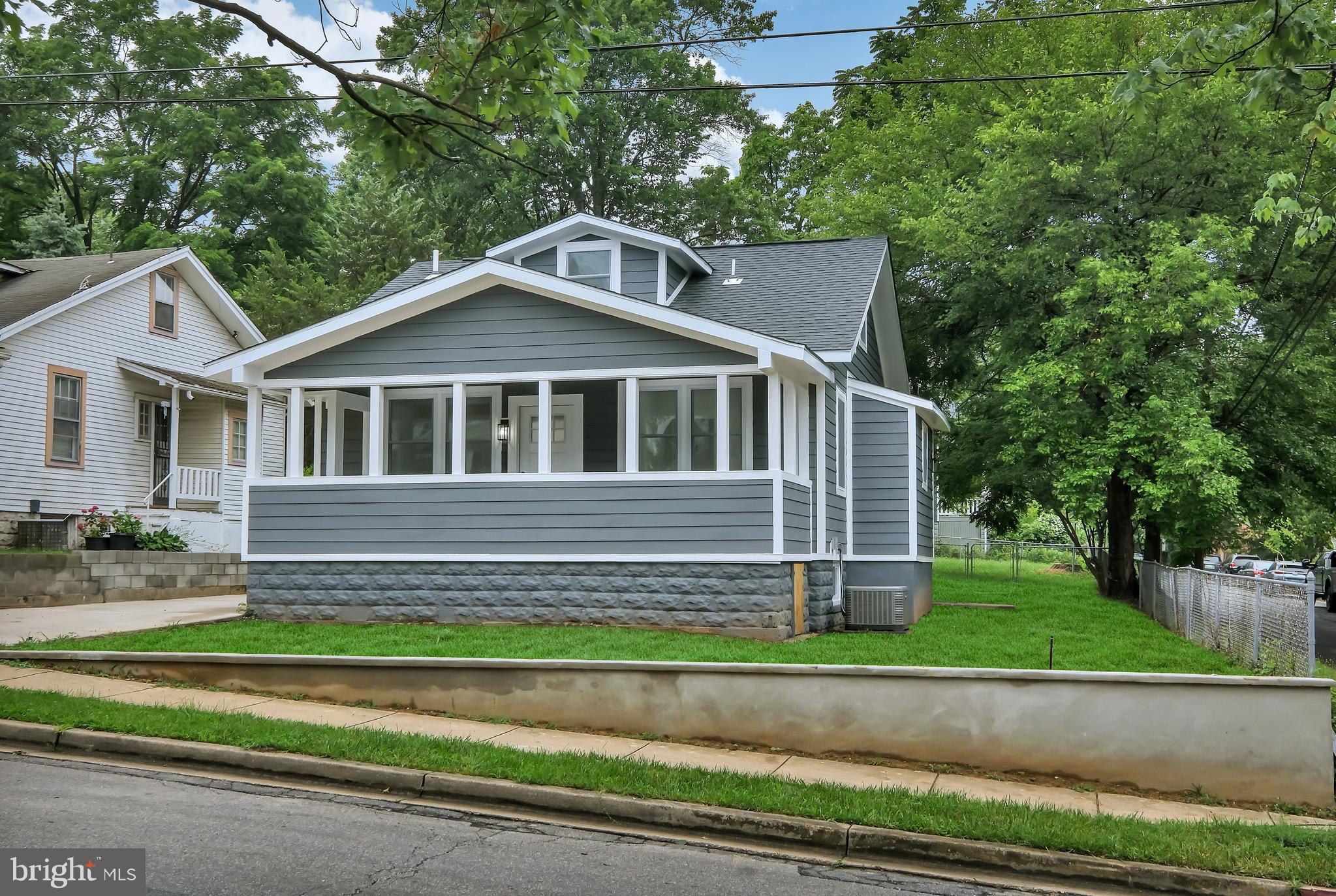 4116 32nd Street Mount Rainier, MD 20712 - Photo 5 of 51 a front view of a house with a garden