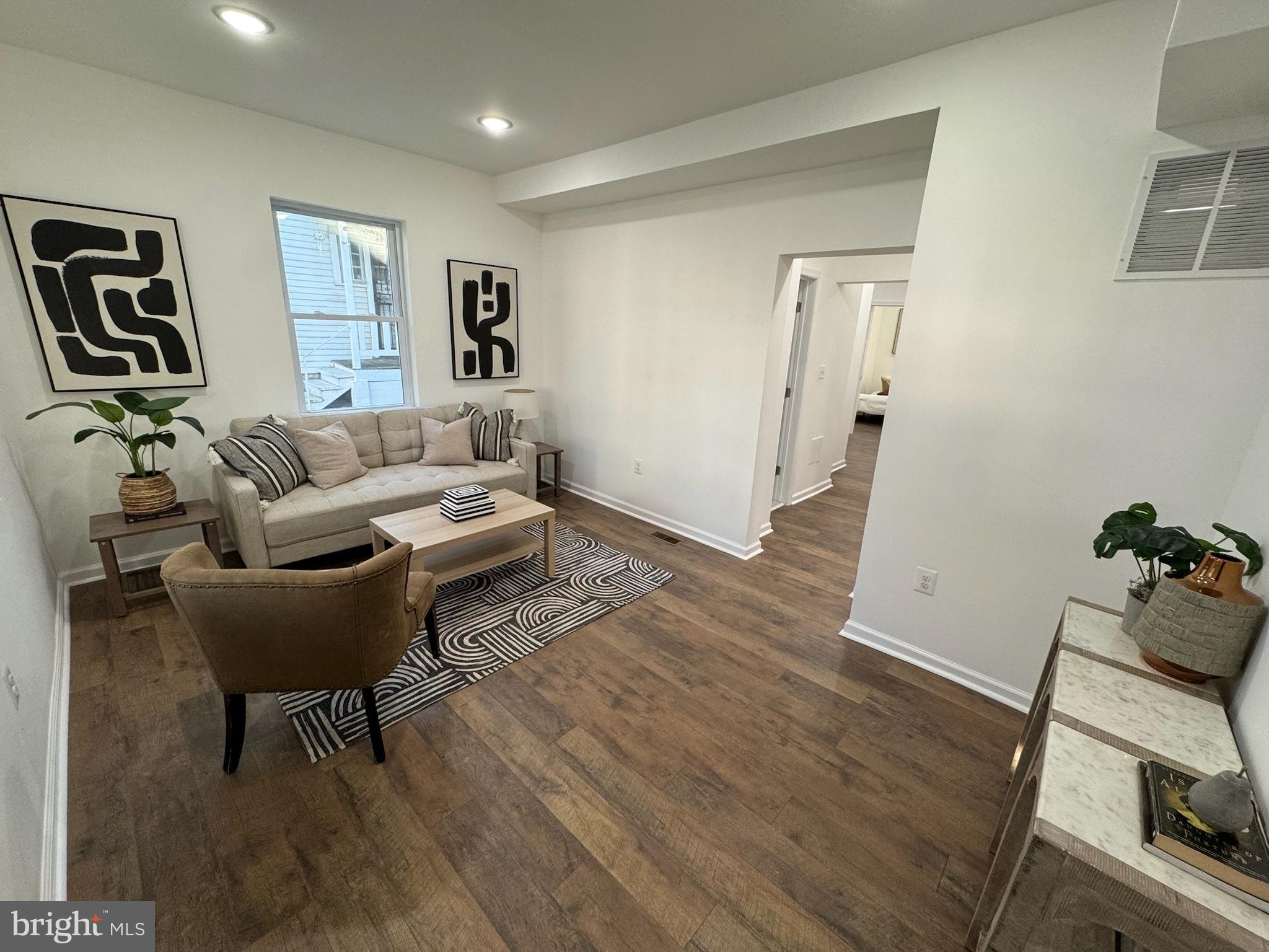 4116 32nd Street Mount Rainier, MD 20712 - Photo 8 of 51 a living room with furniture and wooden floor
