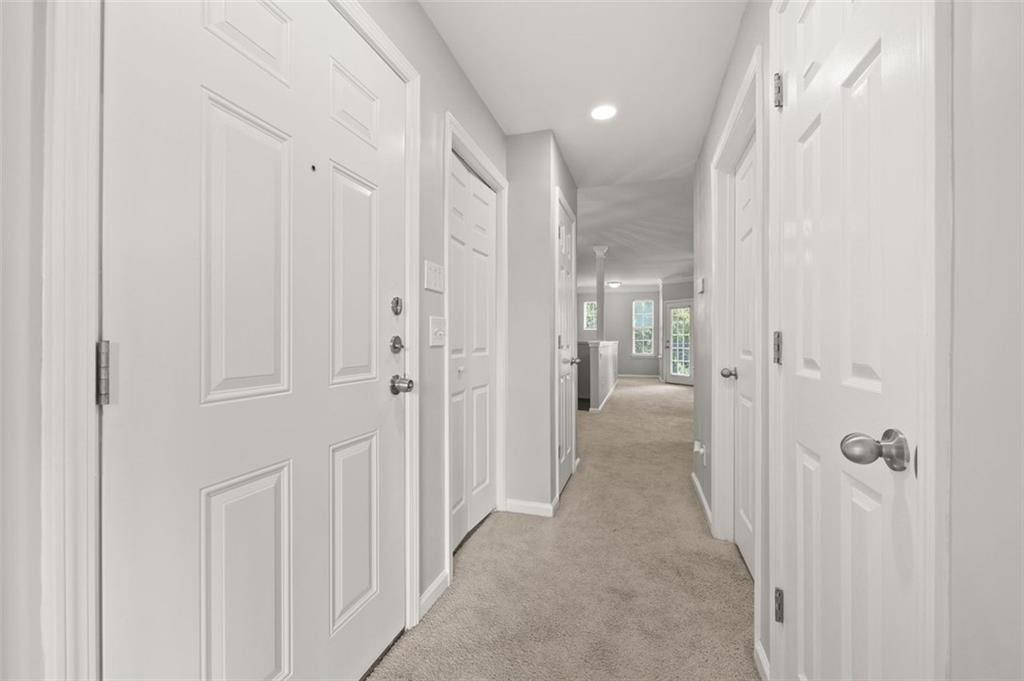 1752 Pryor Road Southwest, Unit 111 Atlanta, GA 30315 - Photo 12 of 20 a view of a hallway with wooden shelves