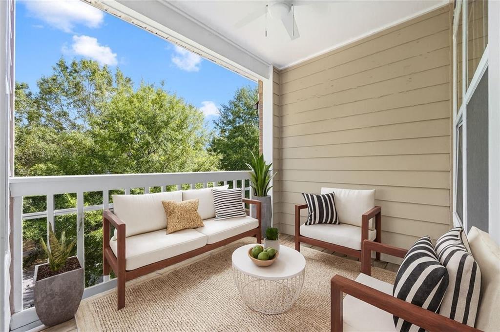 1752 Pryor Road Southwest, Unit 111 Atlanta, GA 30315 - Photo 16 of 20 a view of a patio with couches and potted plants with sky view