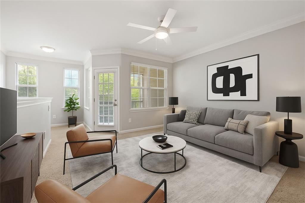 1752 Pryor Road Southwest, Unit 111 Atlanta, GA 30315 - Photo 3 of 20 a living room with furniture and a large window